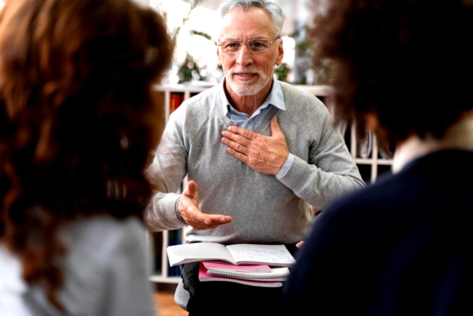 Person reviewing financial documents with charts and graphs